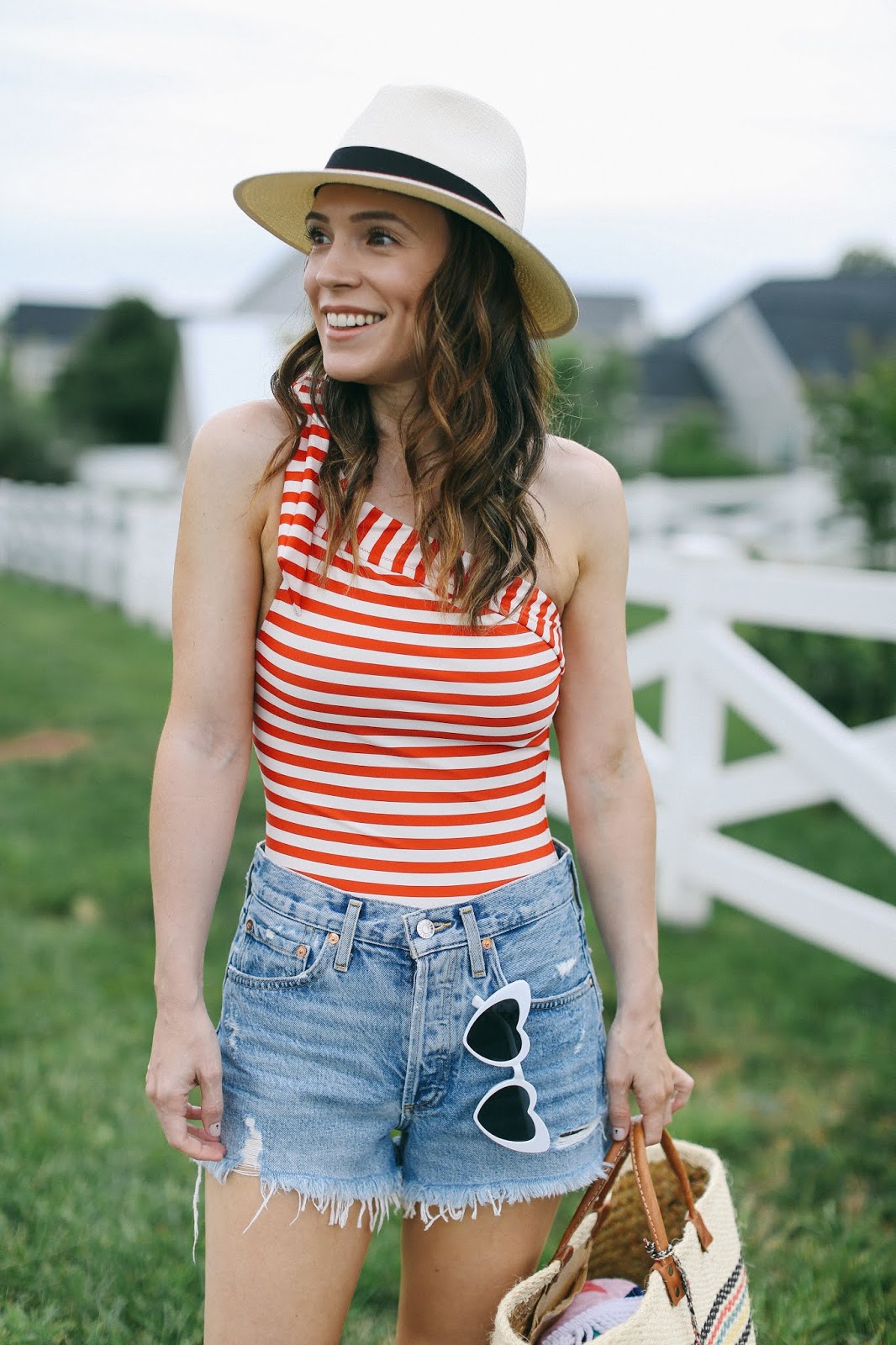 striped one shoulder swimsuit with denim shorts